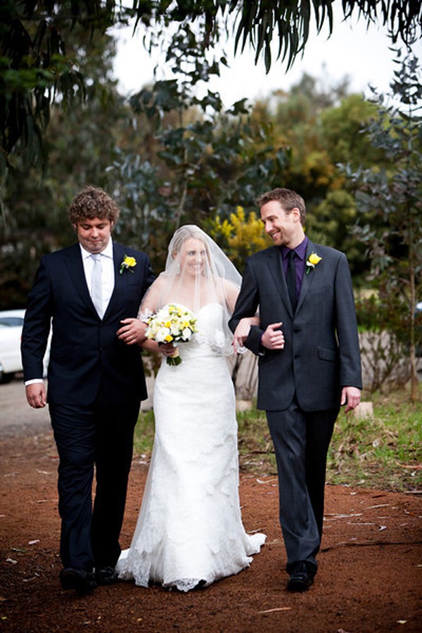 Jane is lovingly walked down the aisle by brothers