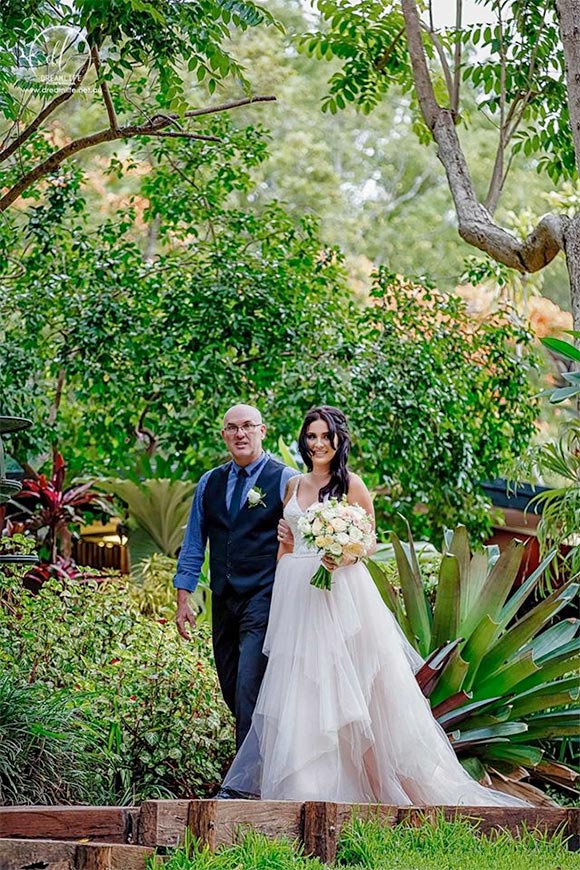 father of the bride walking her down the aisle