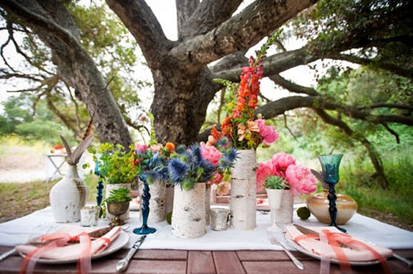 Bohemian flower arrangement against forest backdrop