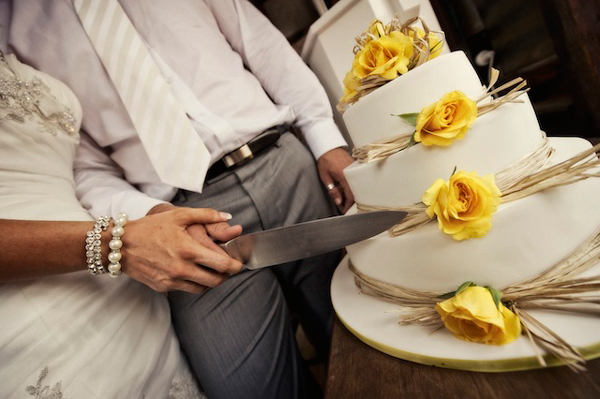 Cutting the wedding cake as man and wife