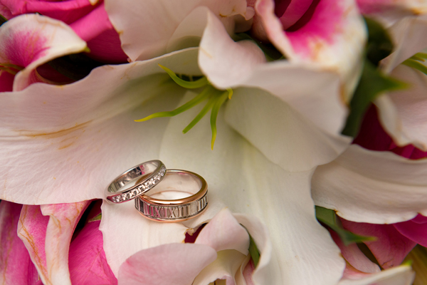 Closeup of wedding ring with flowers