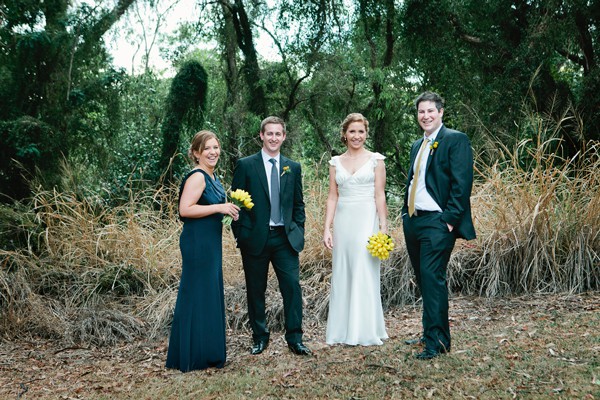 Bridal party and groom part in bush