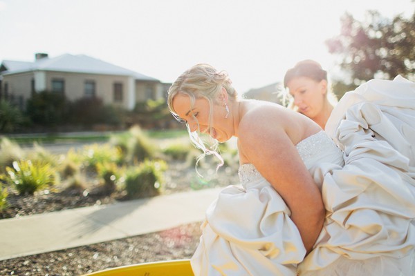 Bride having fun in her wedding dress