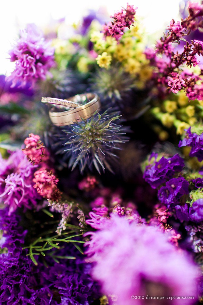 Wedding rings and purple flowers