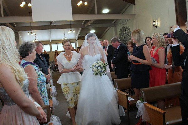 Mother of Bride walking the aisle with the bride