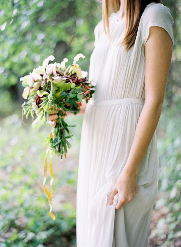 Bohemian inspired wedding dress at altar