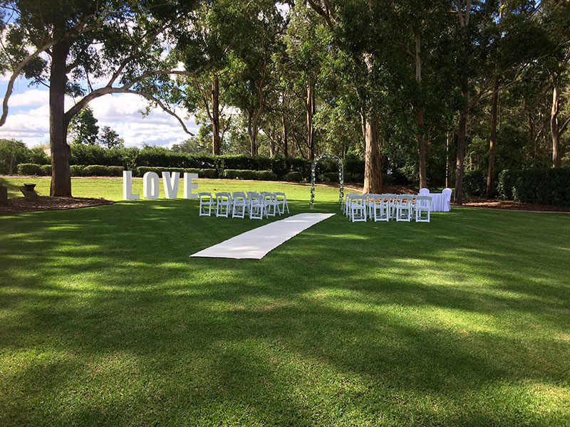 Outside wedding ceremony on the lawn at Highfields Cultural Centre