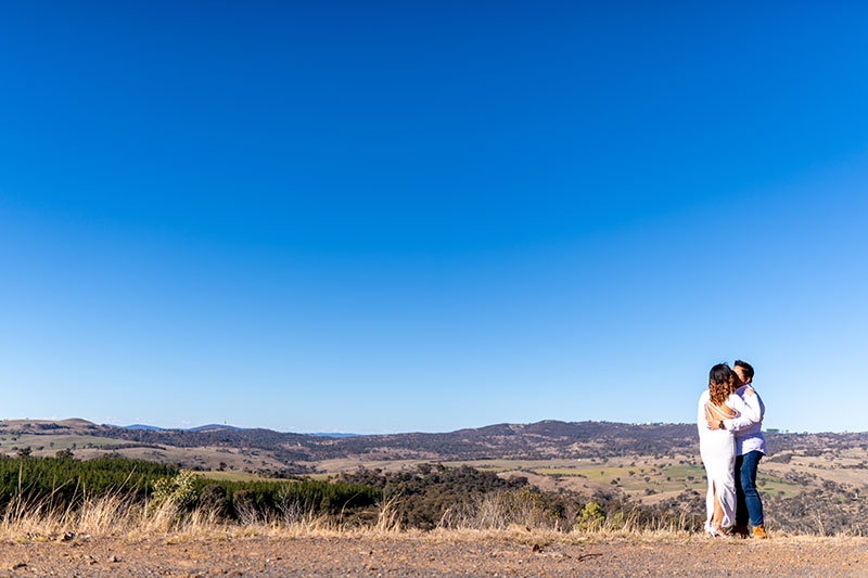 Bride and Groom together under a beautiful blue sky and country surrounds.