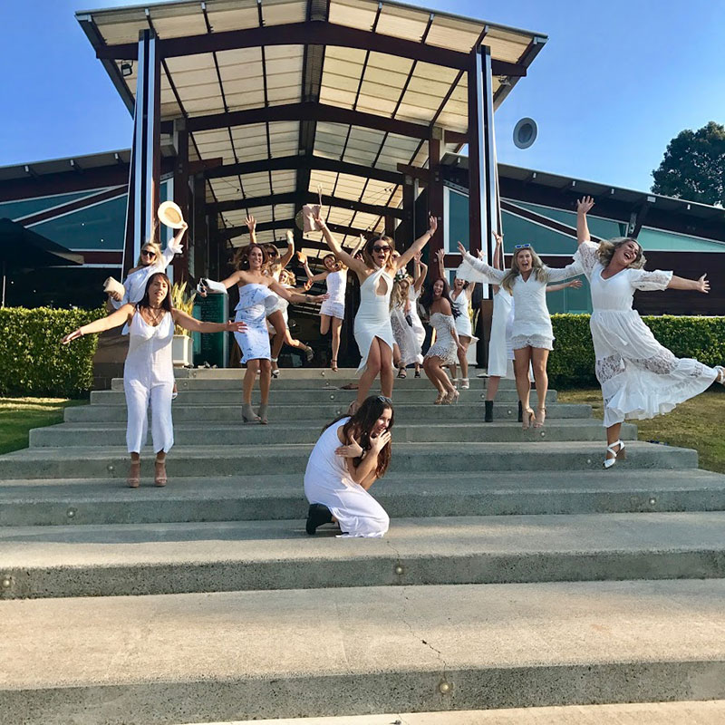 Hens jumping on steps for food and wine tour