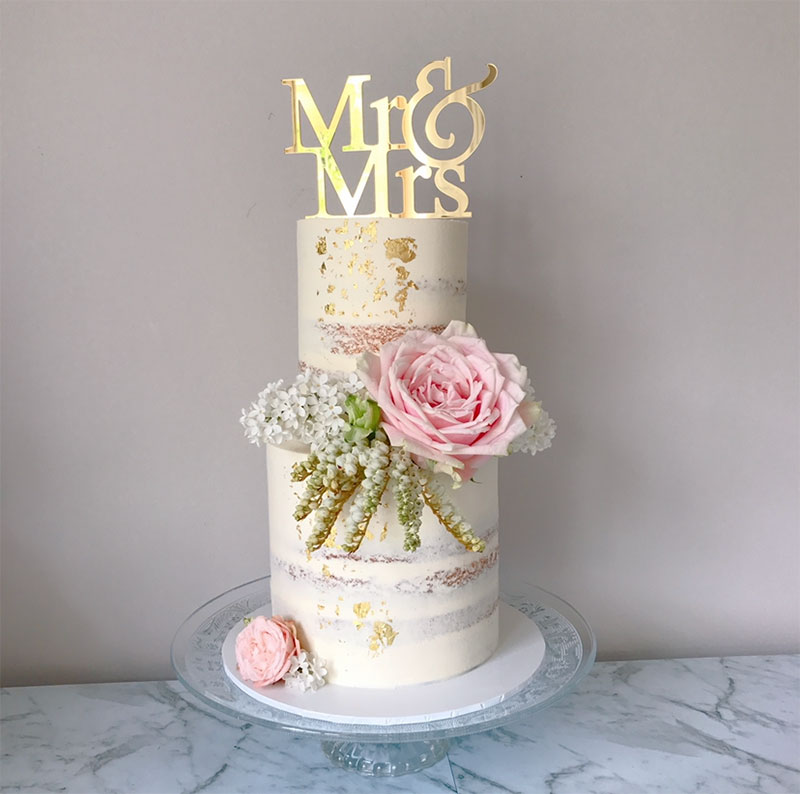 Rustic wedding cake with pink florals by Sweetcakes Co.