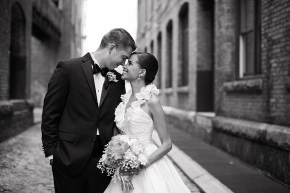 Bride and groom in street black and white photo