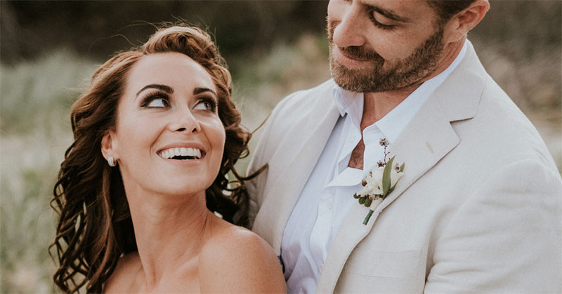 Bride smiling at Groom with beautiful white teeth.