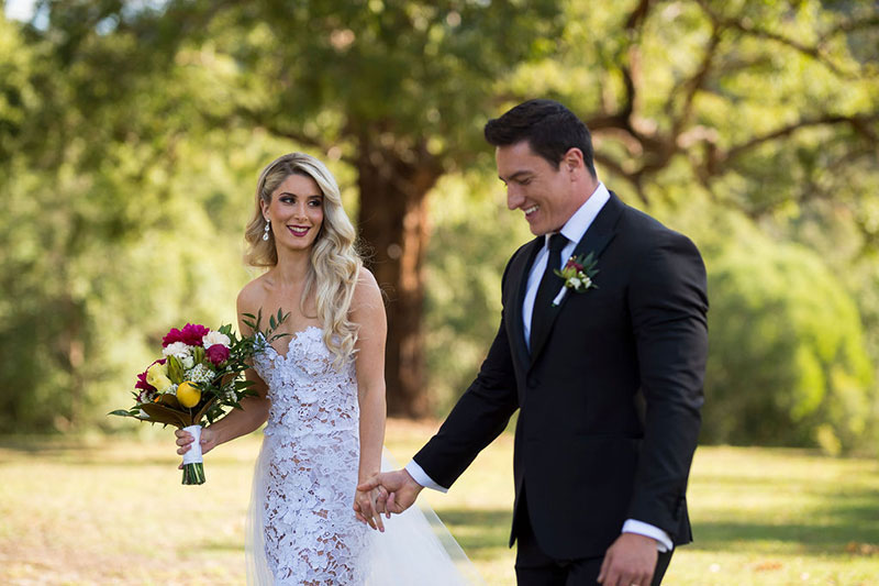 Photo taken by Leigh Warner Weddings of Bride and Groom walking together.