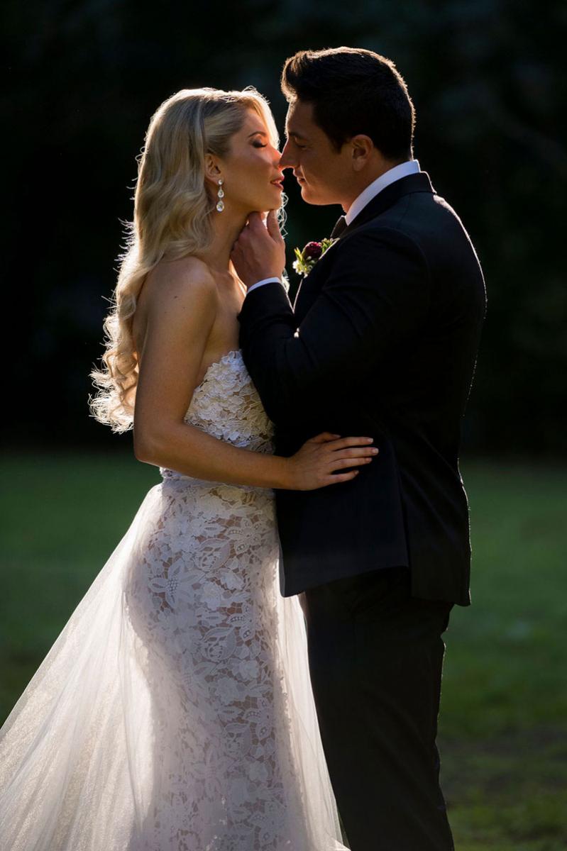 Photo taken by Leigh Warner Weddings of Bride and Groom about to kiss.