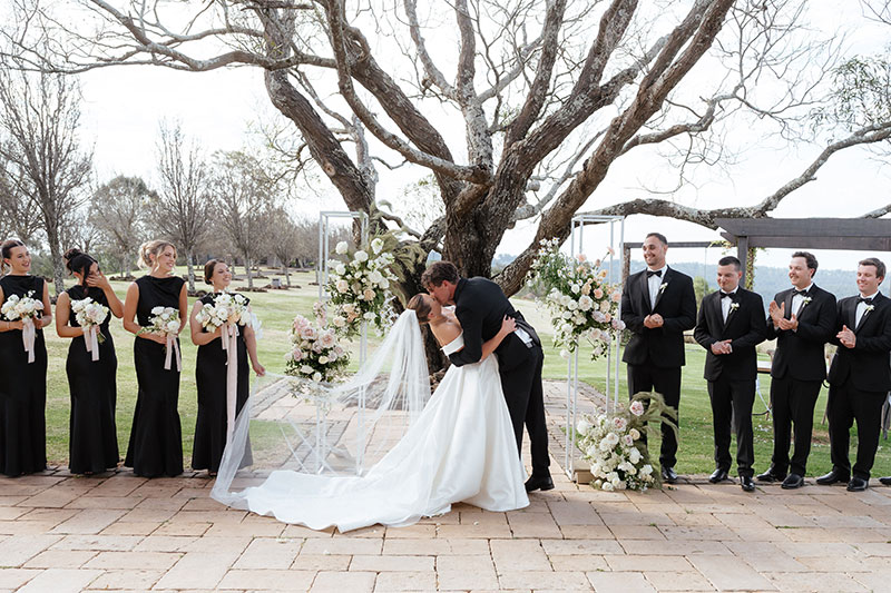 Chelsea and Christian kissing after being declared married.