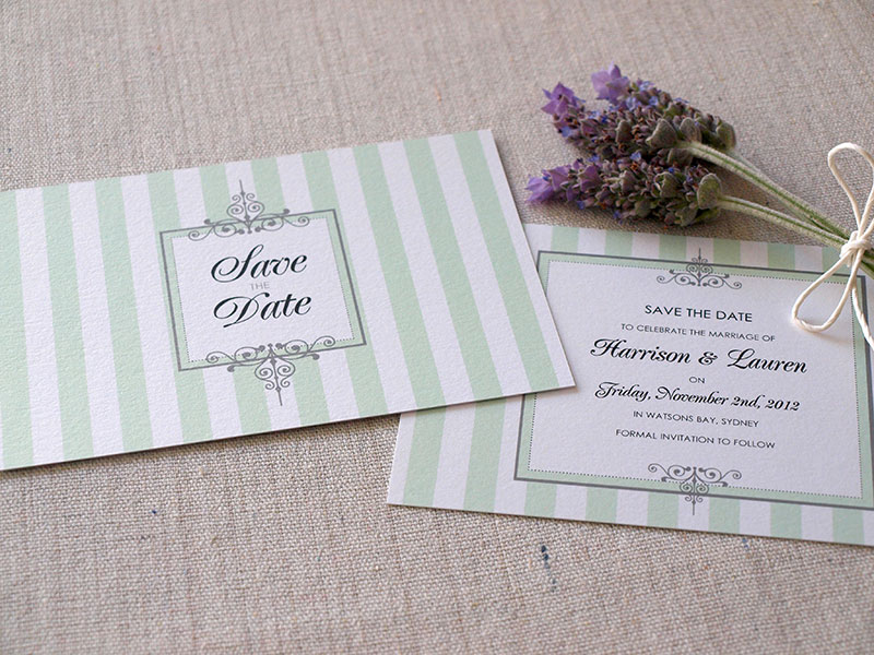 White and green Save-the-Date cards.