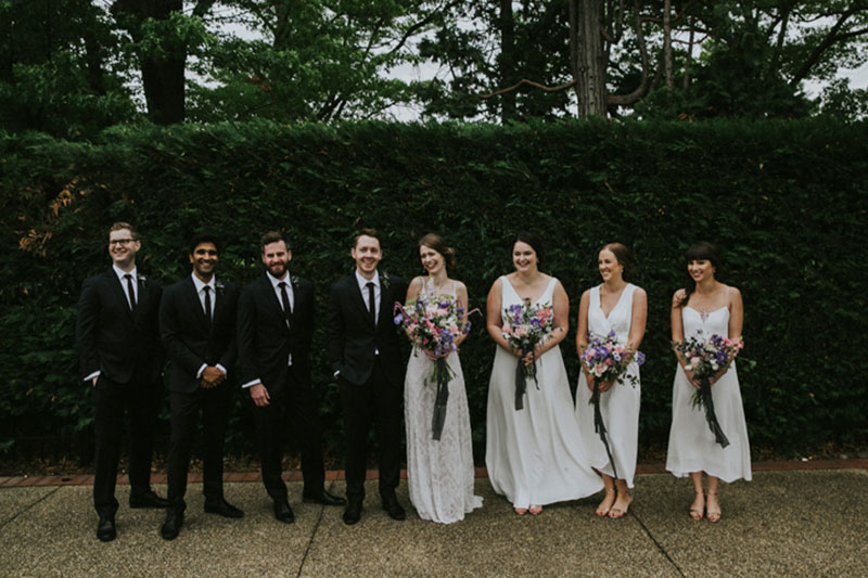 Classic photo of bride, groom and wedding party.