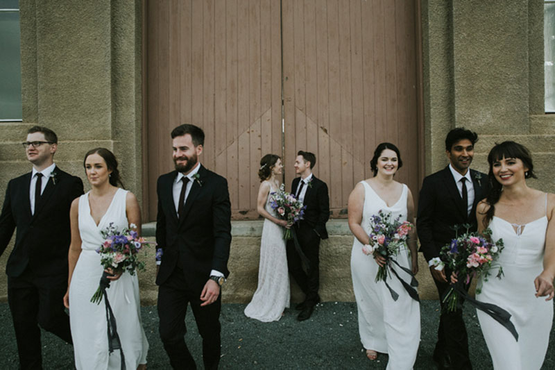 Fusing of traditional and candid style photo of couple and their wedding party.