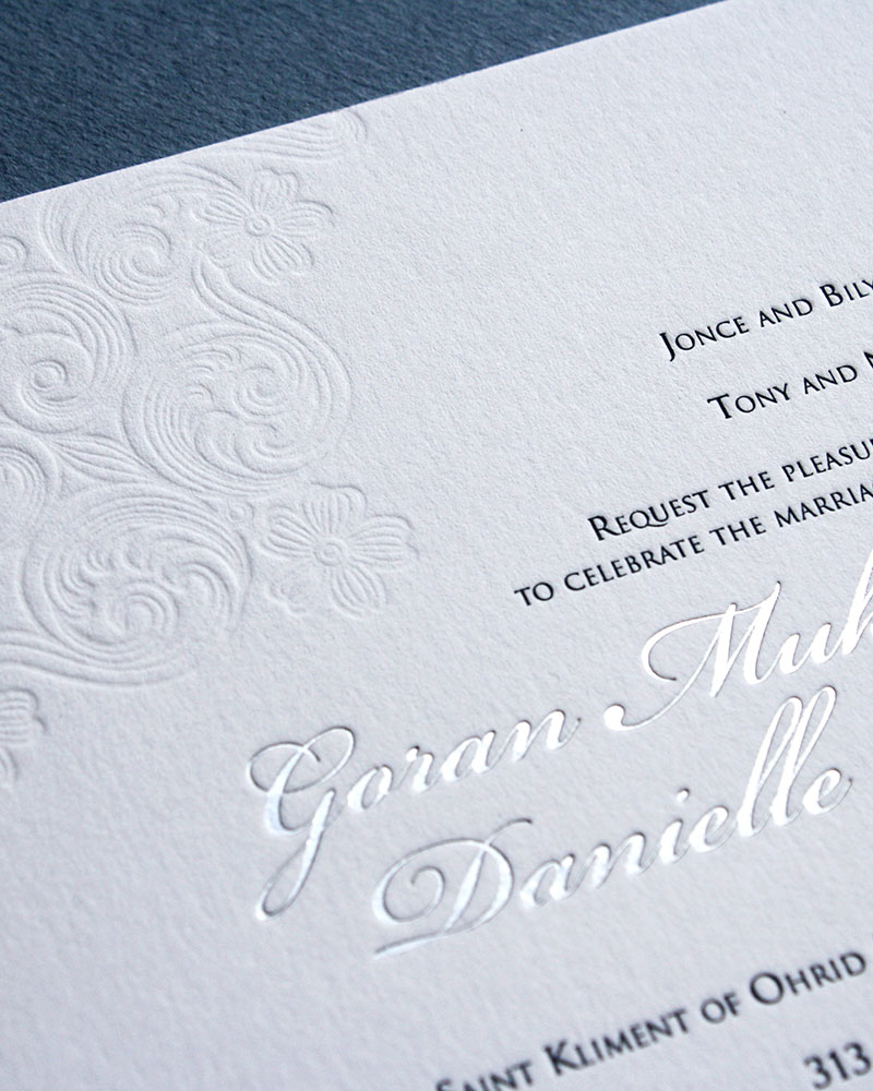 Silver foil letters on white letterpress wedding stationery.
