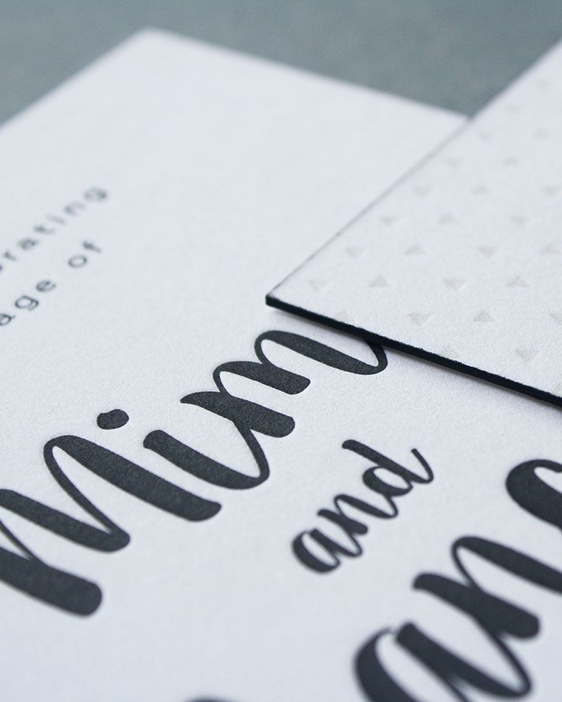 Modern black text on white wedding invitations.