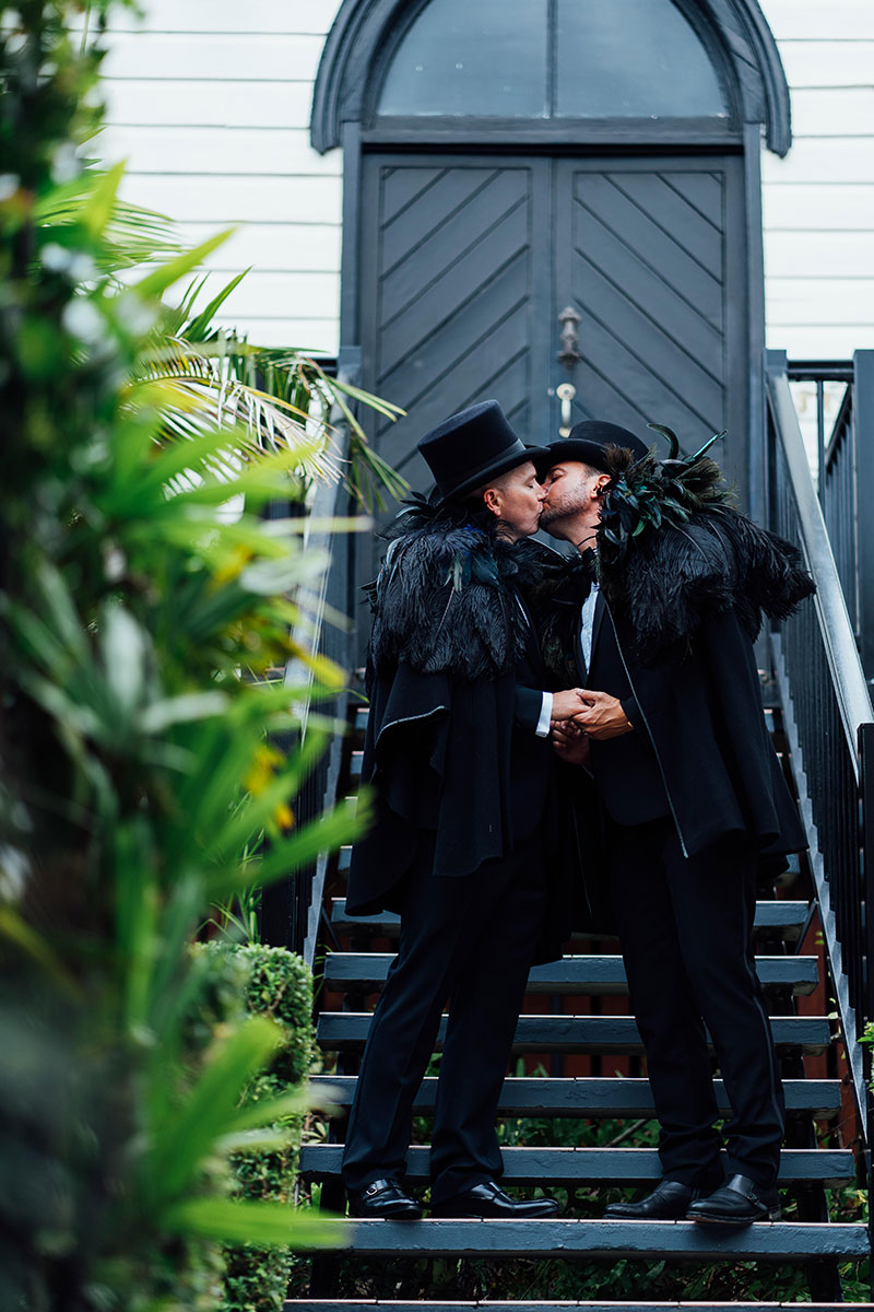 Brad and Scott kissing at Broadway Chapel.