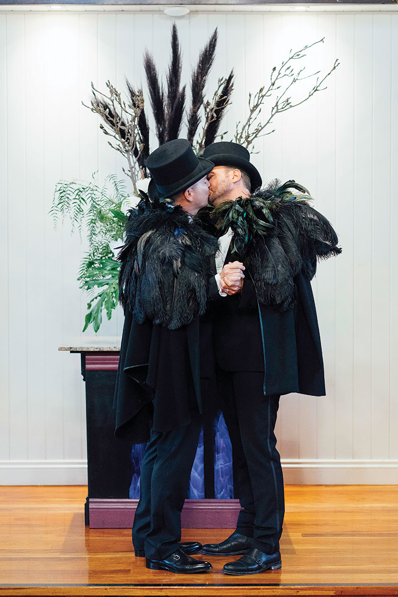 Brad and Scott kissing after exchanging vows at Broadway Chapel