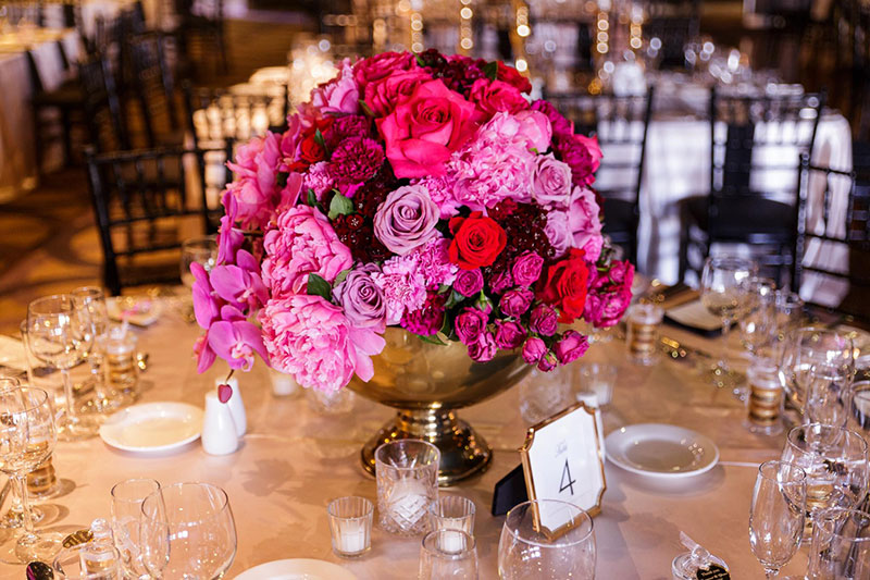 Gorgeous bright flower wedding centrepiece.