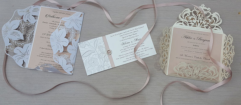 Assortment of wedding invitations.