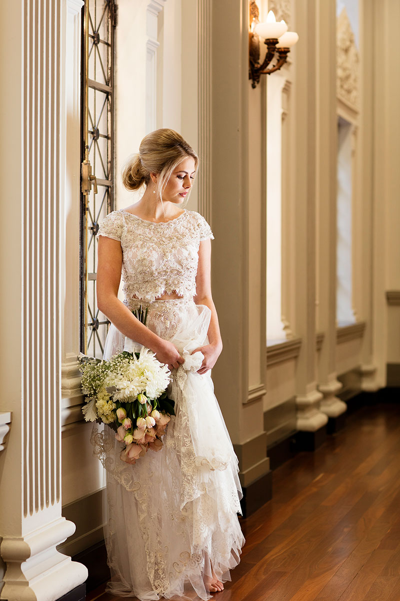 Bride wearing a two-piece Fiorenza wedding gown.