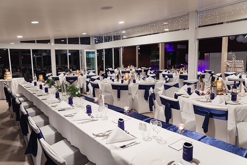 Reception area at Headland Golf Club set up for a wedding.