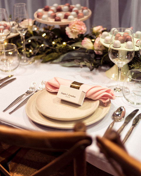 little cocoa chocolates in a giftbox at a wedding table setting.