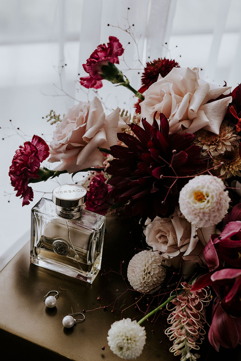 Gorgeous flowers, earrings and perfume.