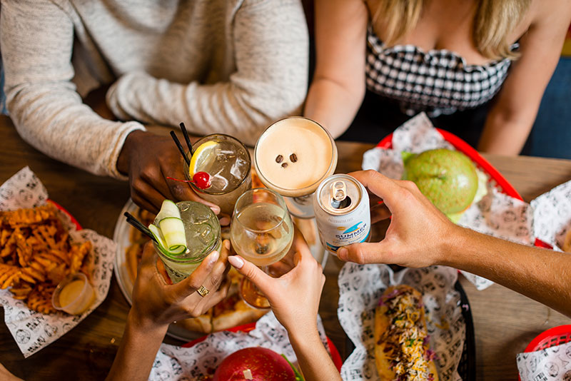 Men and women drinking cocktails