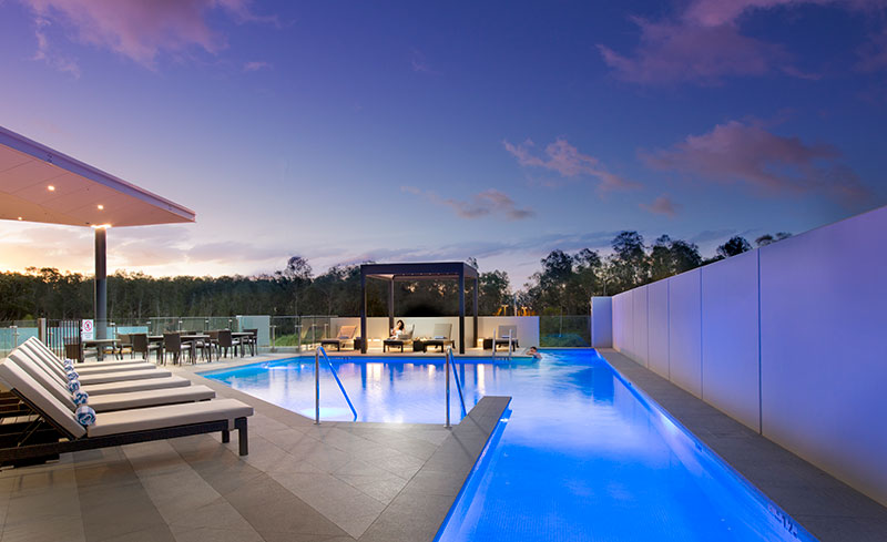 Sleek blue pool and pergola at the Pullman Brisbane Airport.