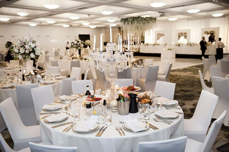 Wedding reception set up with fresh white linen at QT Canberra.