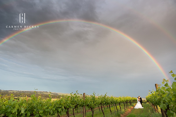 The perfect shot, Margaret and Michael pose under a rainbow straight after a storm.