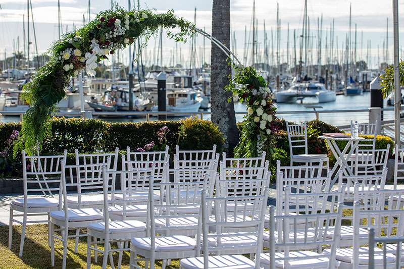 Tiffany chairs set up for a wedding ceremony.