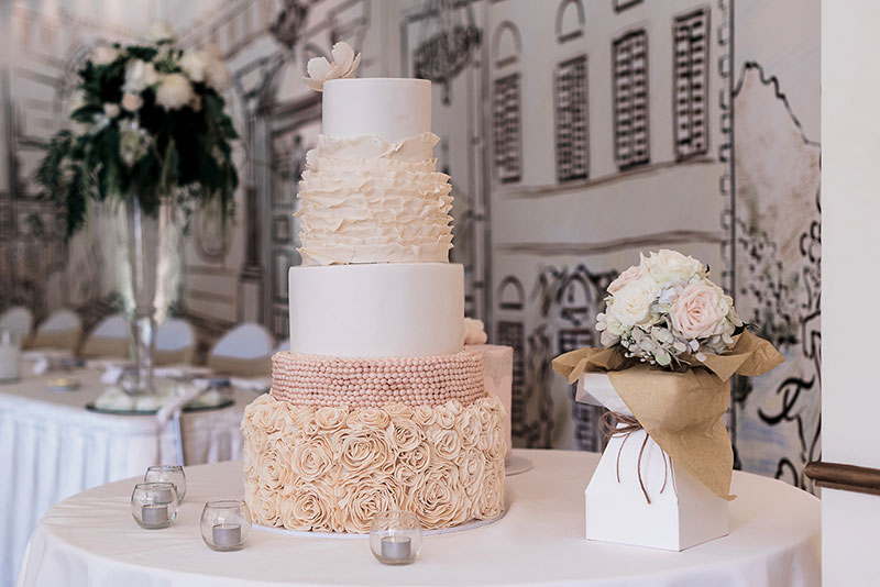 Rosette and ruffle 4 tiered wedding cake.