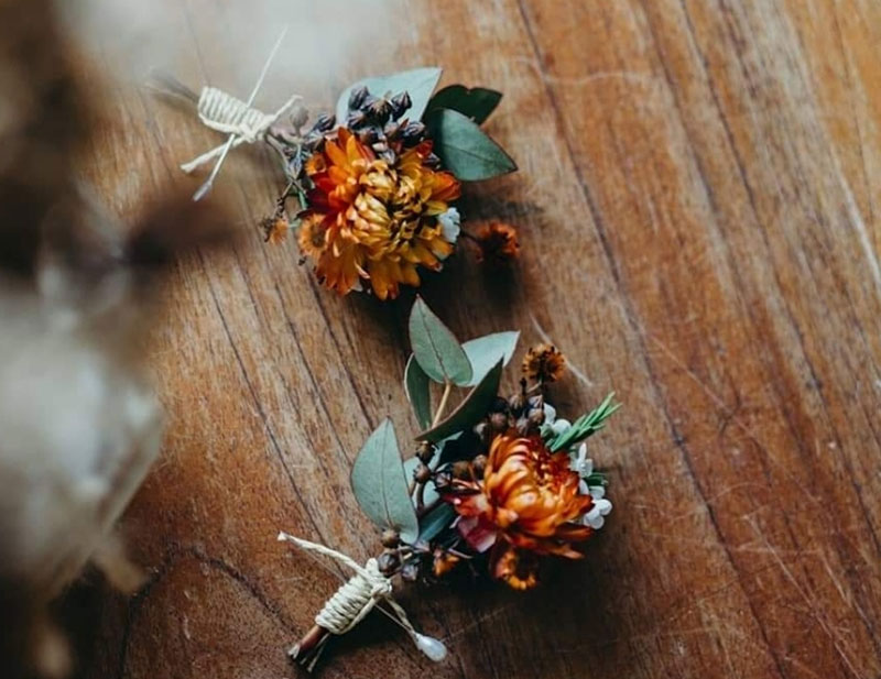 Two small bright native flower wedding bouquets.