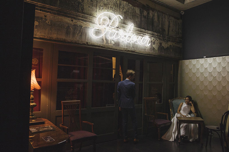 Bride and groom in vintage setting.