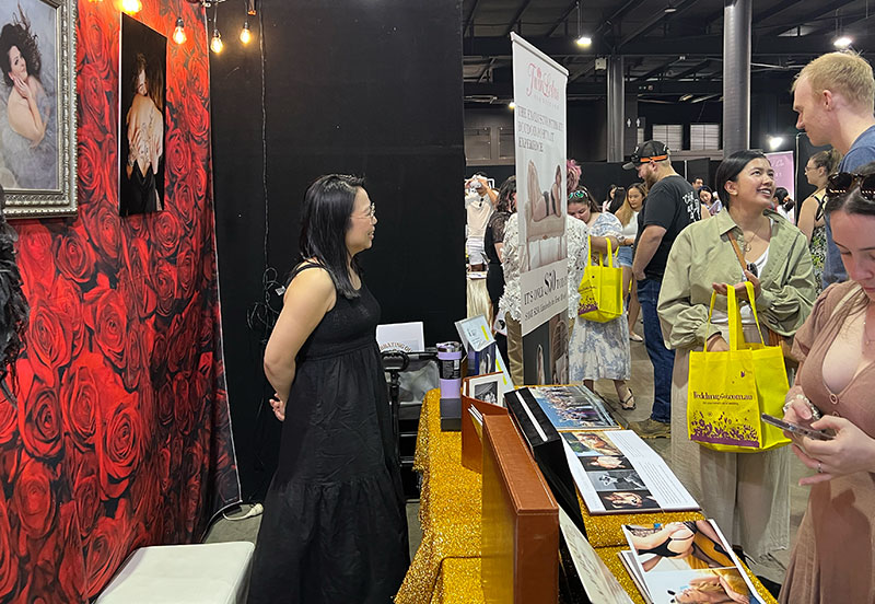 Couple making decisions at Your Local Wedding Guide Expo