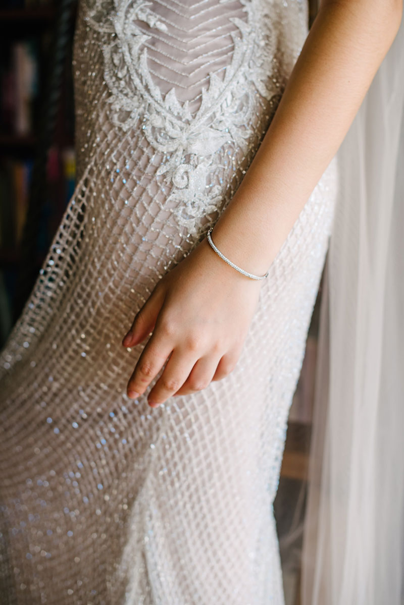 Close up sideview of boho inspired wedding gown.