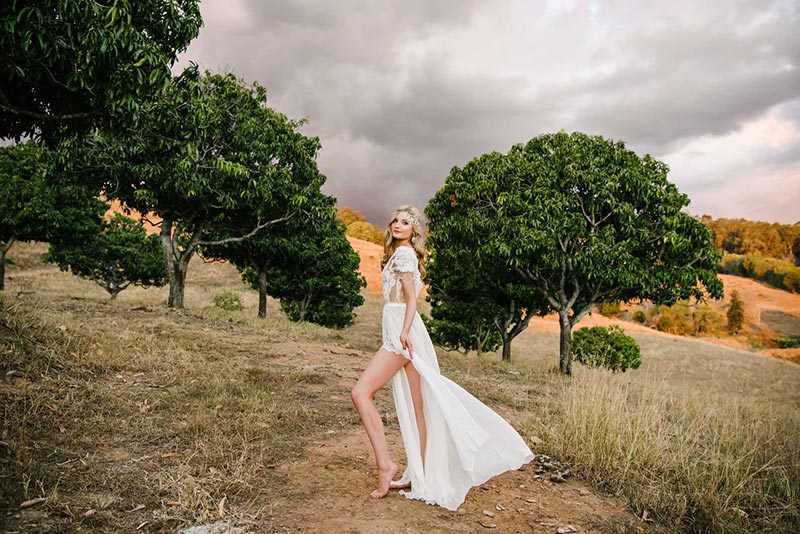 Bride showing of boho inspired skirt with multiple splits.