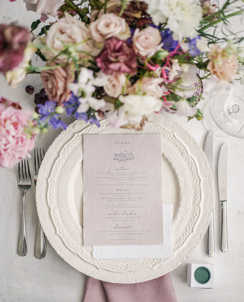 Wedding Menu stationery placed on white plate.