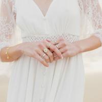 Beautiful variety of rings worn by bride.