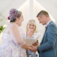 Annette Richards Celebrant laughing with happy Bride and Groom at their wedding ceremony.