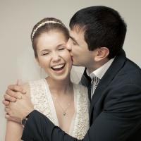 Young newlyweds kissing