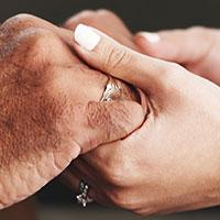 Couple holding hands.