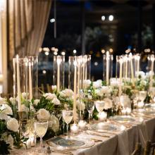 Beautiful bridal table decor with floral arrangements and candles styled by Mayflower Designs.