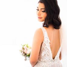 Bride turning around for a photo taken by Sunlit Studios.